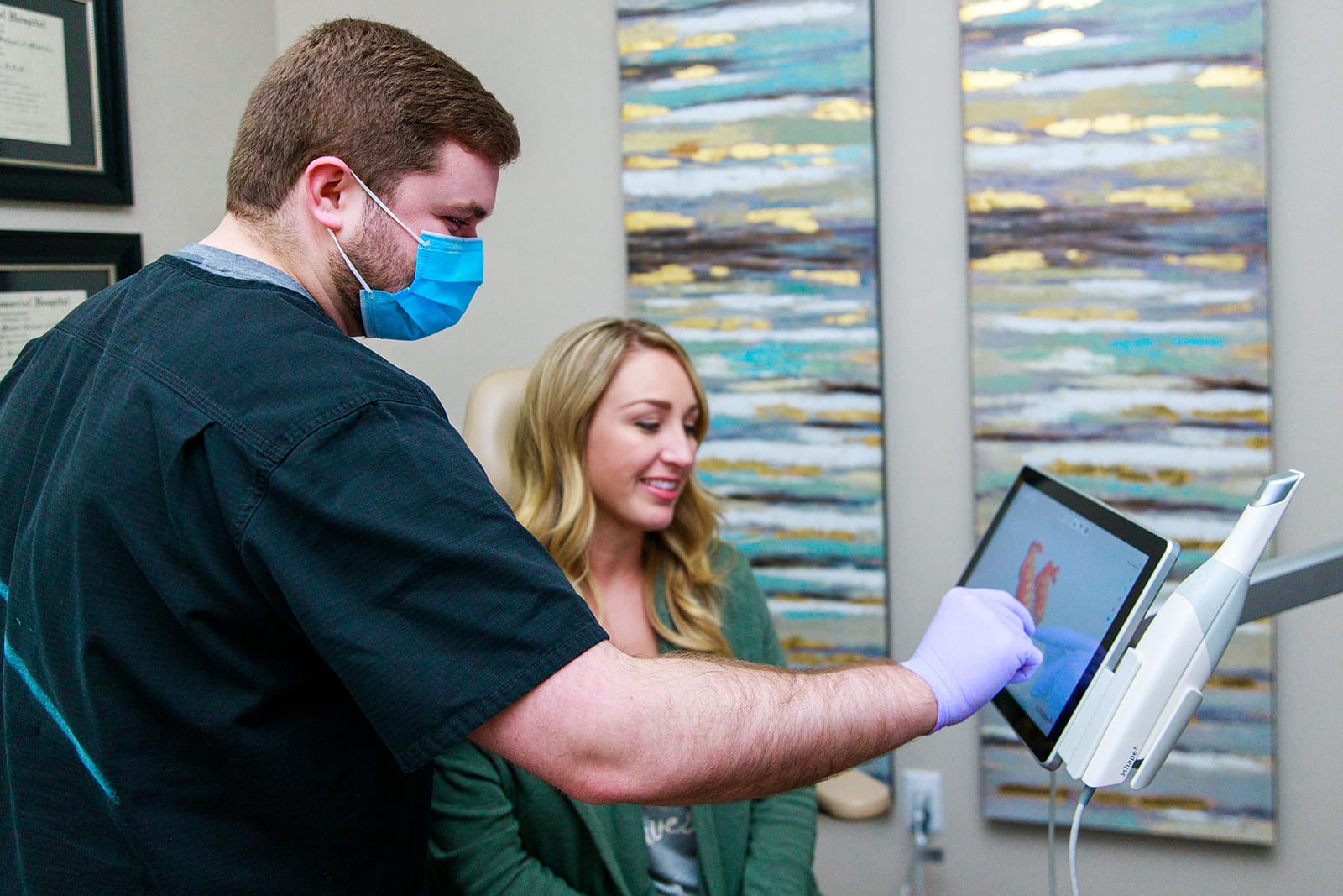 Dr. Seth R. Brooks Showing Patient a Digital Impression